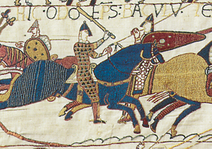 Tapisserie de Bayeux - scène 54. Odon de Conteville, l’évêque de Bayeux, n’hésite pas à manier la massue. (© Ville de Bayeux)